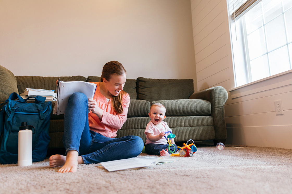 Student Parent Studying on Floor Student Parent Studying on Floor
